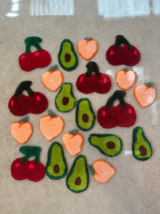 Set of felt fruit and vegetable shapes on a neutral background