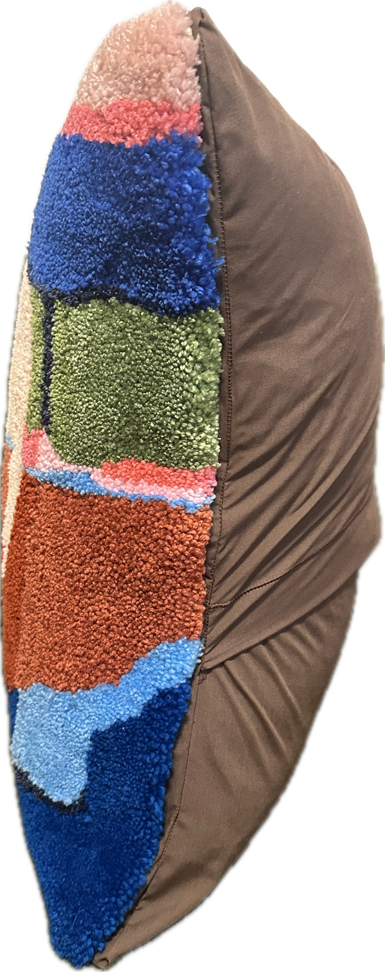 Multicolored textured pillow with a brown base on a white background