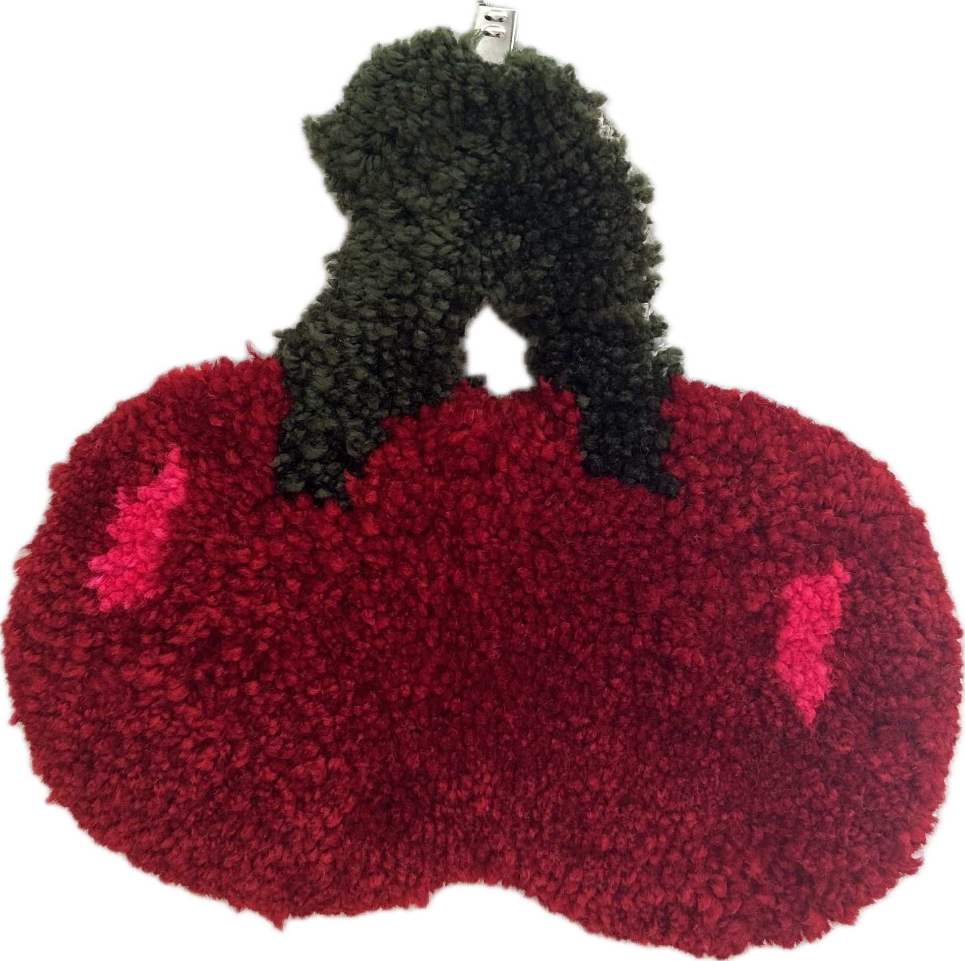 Red cherry rug against a white background